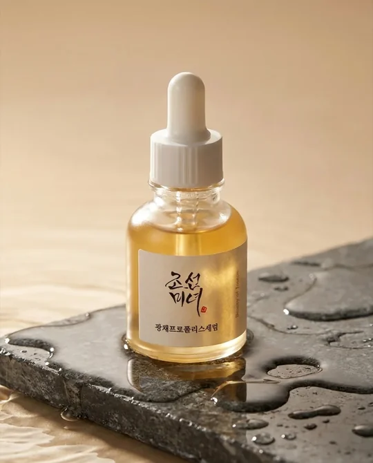 Serum dropper bottle on wet slate, used as the product photo